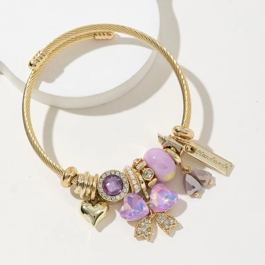Purple bow tie shaped charm bracelet